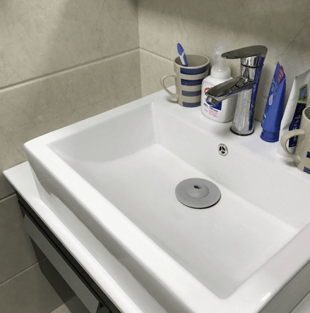 Dual Purpose Drain Stop and Hair Catcher